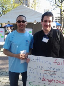 Rev. Brewster, chief organizer of "Circle the Square with Prayer" poses for a picture with me.